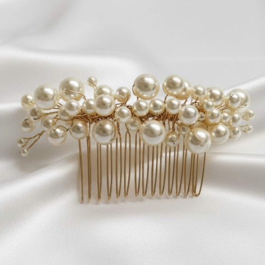 bridal Pearl hair comb on a white fabric background