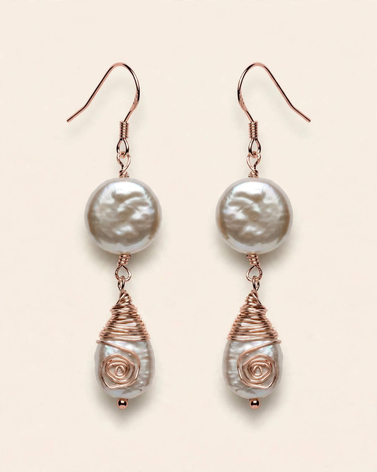 hanging view of pearl drop earrings highlighting teardrop pearl