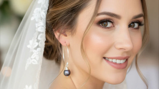Modern bridal jewellery with minimal pearl earrings on ivory fabric, trending for Australian brides in 2026.
