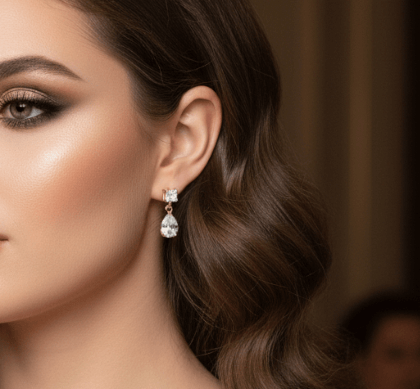 Close-up of a woman wearing a diamond earring with a blurred background
