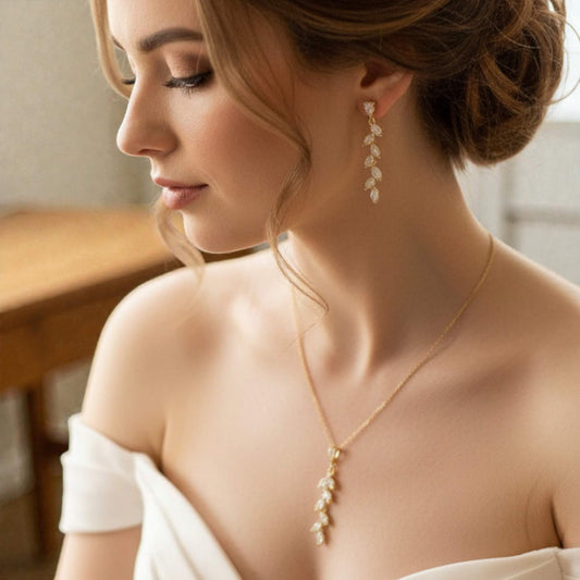 14k gold‑plated leaf jewelry photographed on bride