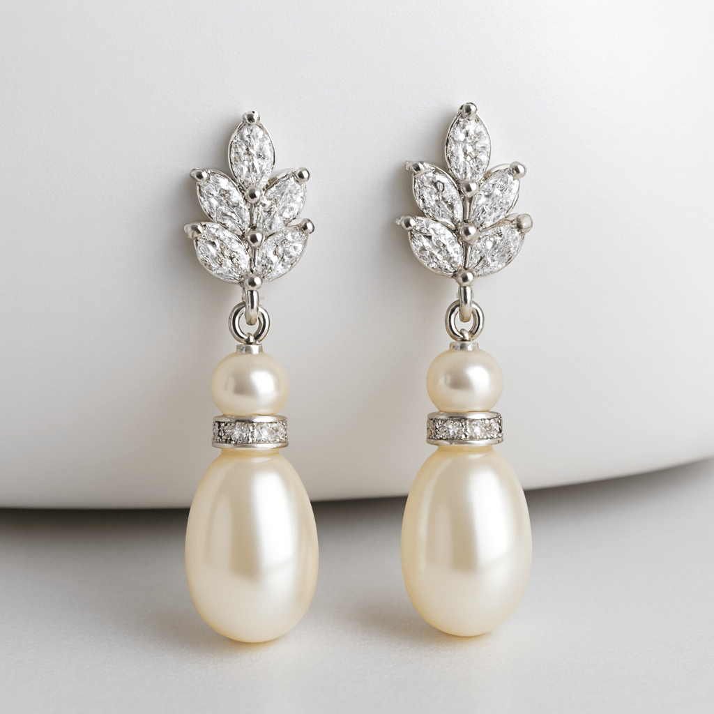 gold-plated freshwater pearl teardrop earrings photographed on clean white surface