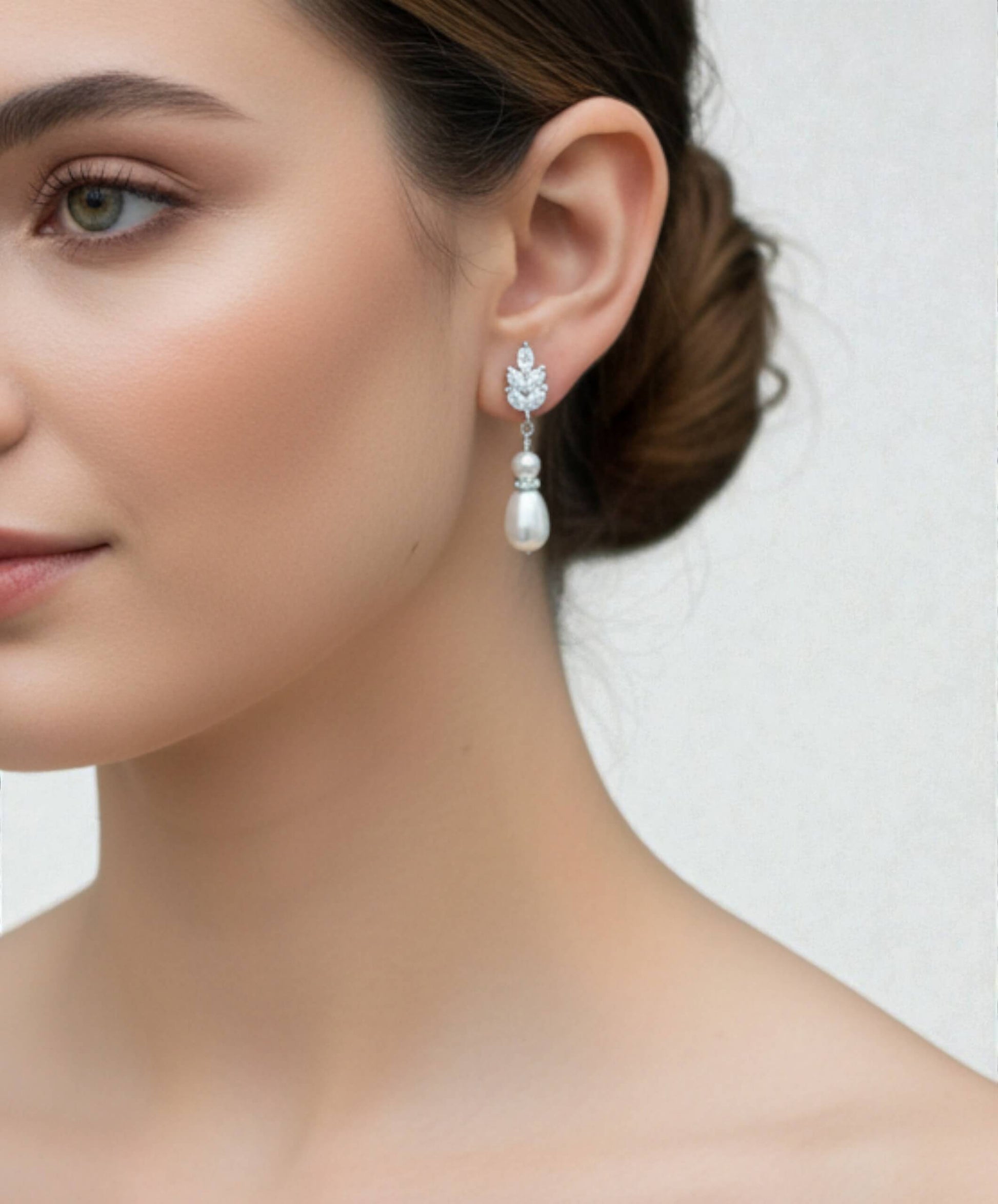 silver freshwater pearl bridal earrings photographed on bride backdrop