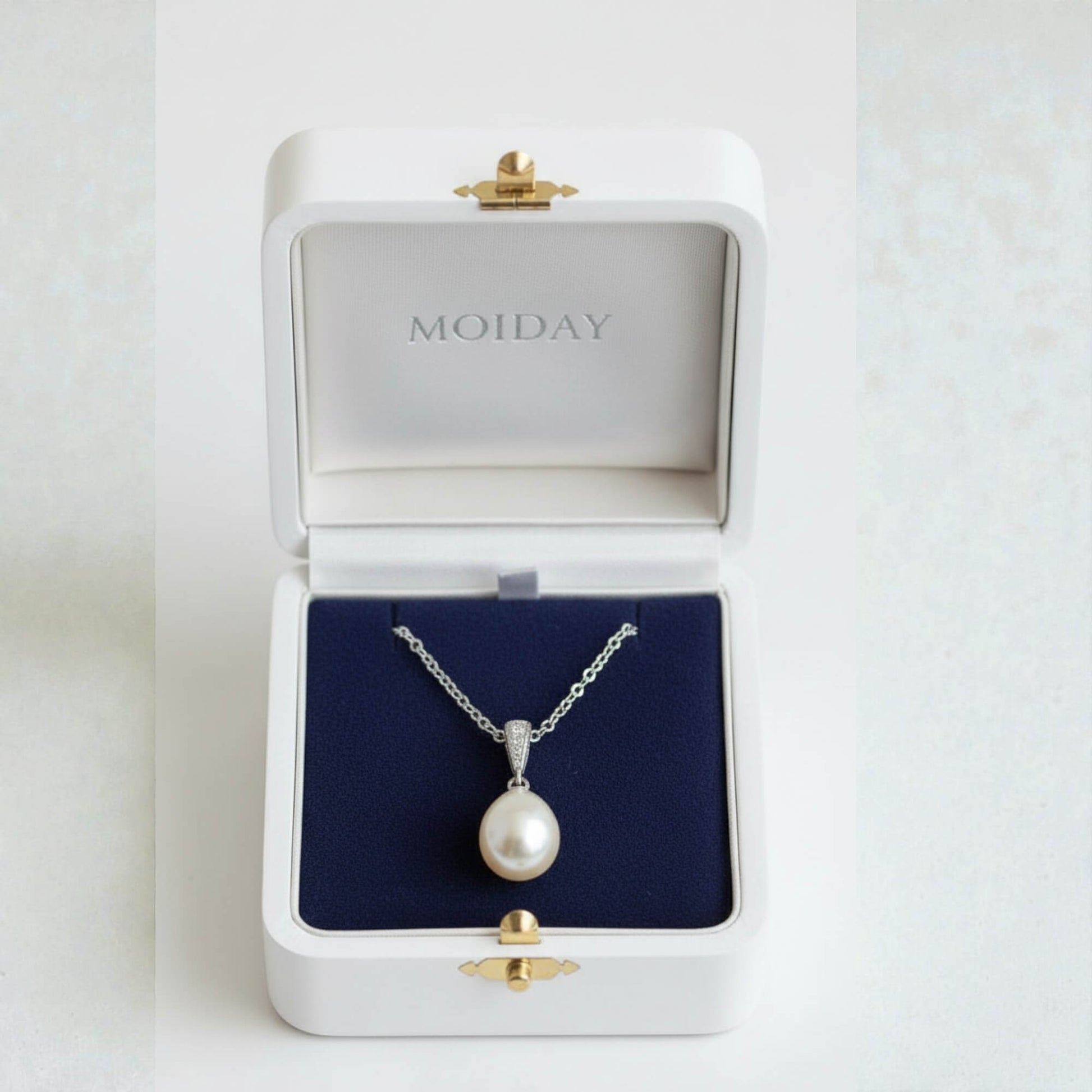 gold-plated freshwater pearl bridal necklace photographed on smooth neutral setting
