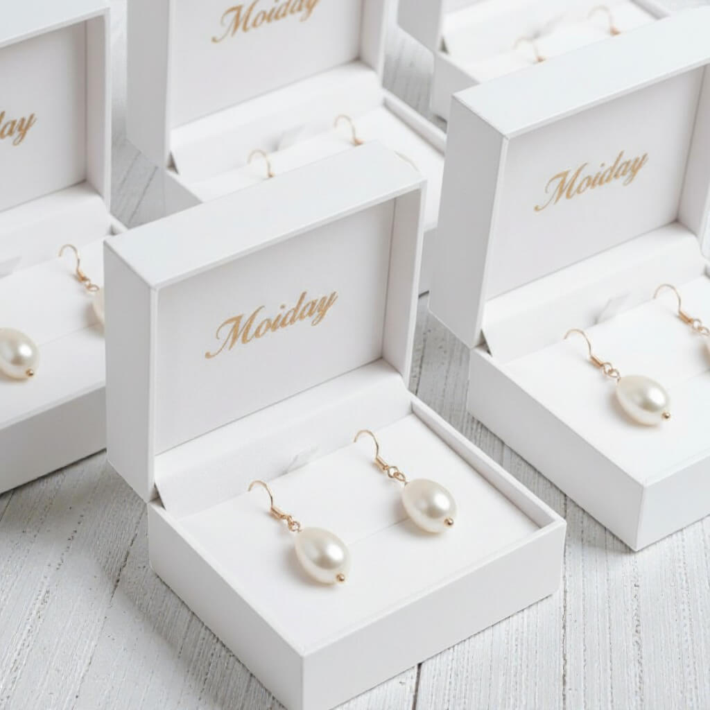 S925 silver hoop drop photographed on neutral warm setting