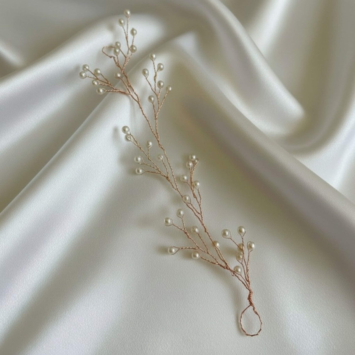 Lightweight pearl hair accessory on satin fabric