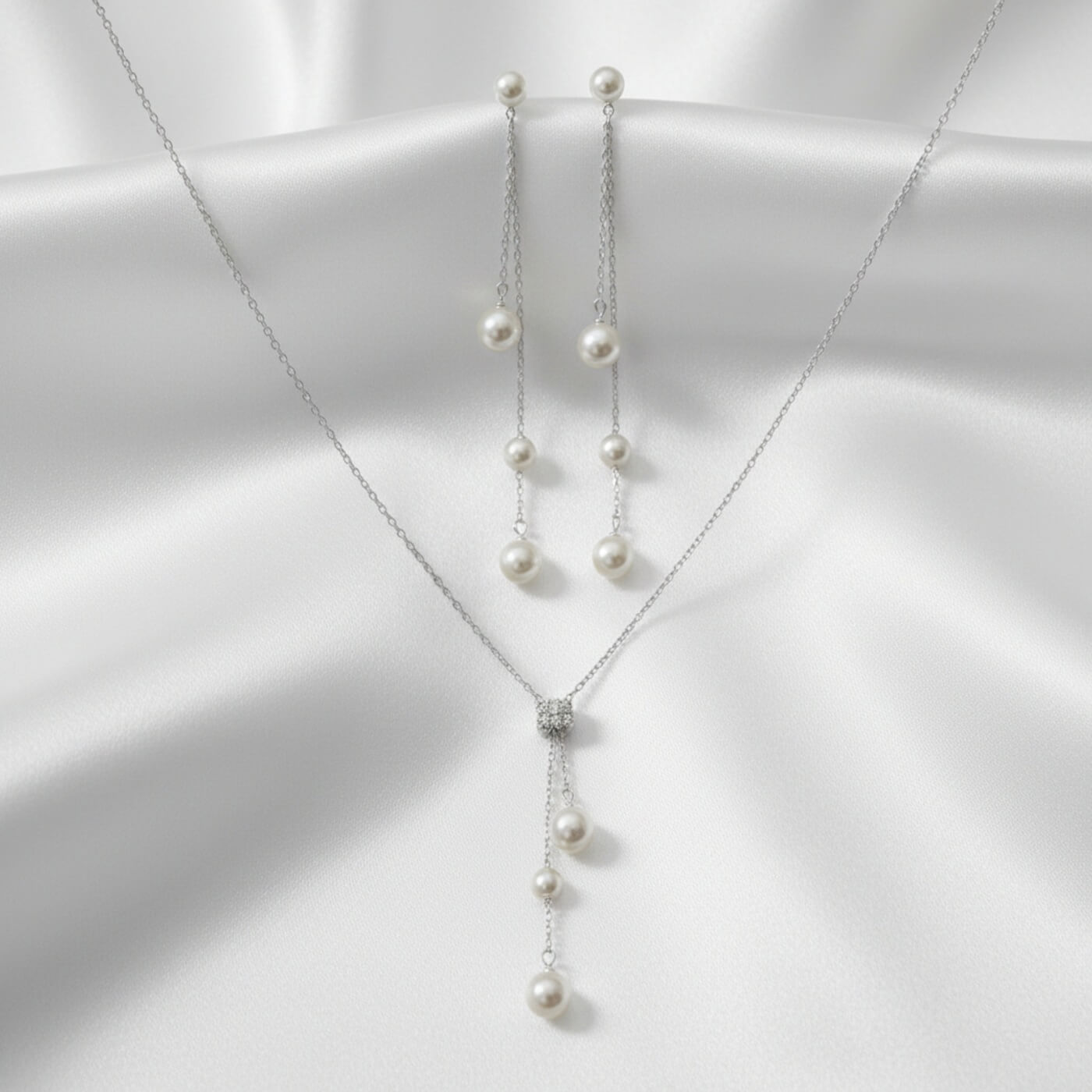 Pearl necklace on a white fabric background