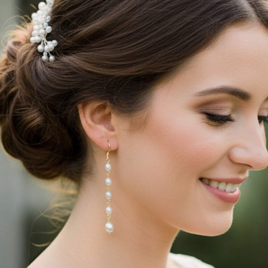 Woman wearing pearl earrings with a blurred background