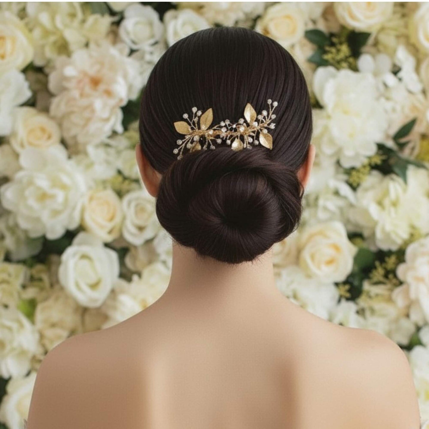 Gold botanical hairpiece photographed on natural stone with soft daylight.