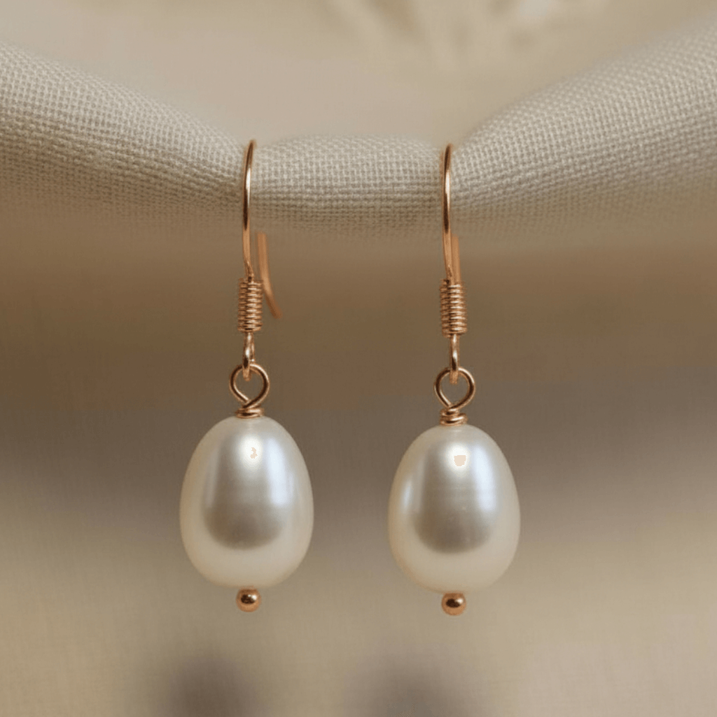 S925 silver minimalist drop photographed on blurred cream background