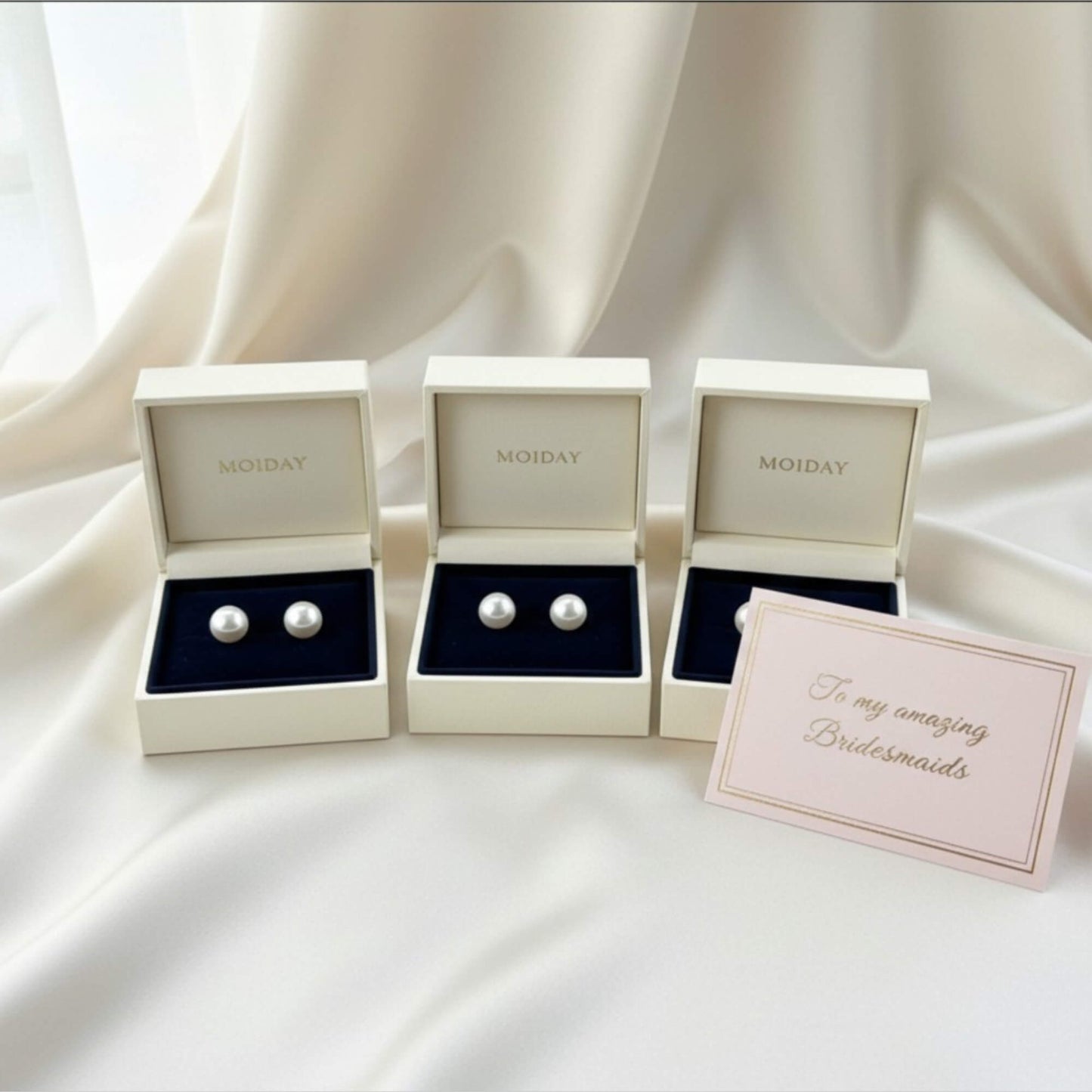 Freshwater pearl stud earrings on satin background, handcrafted in Melbourne