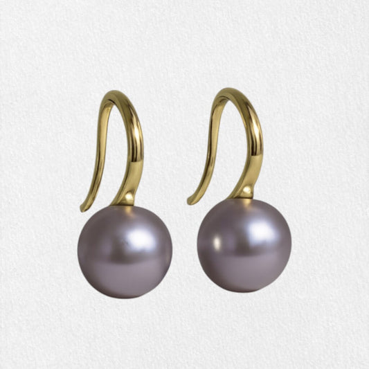 S925 silver pearl drop photographed on white surface