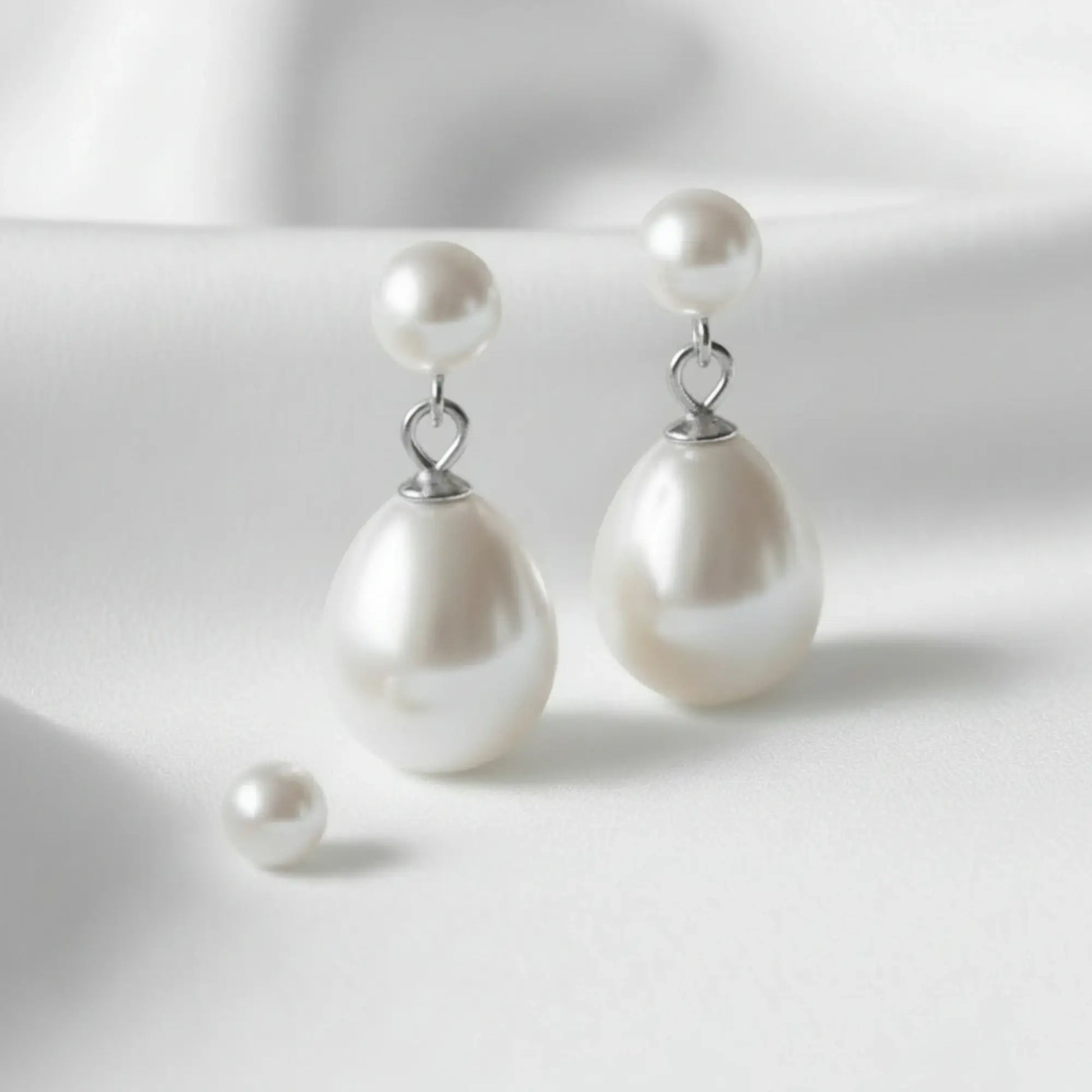 Pearl earrings on a white background
