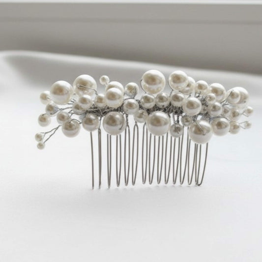 Pearl hair comb on a white background