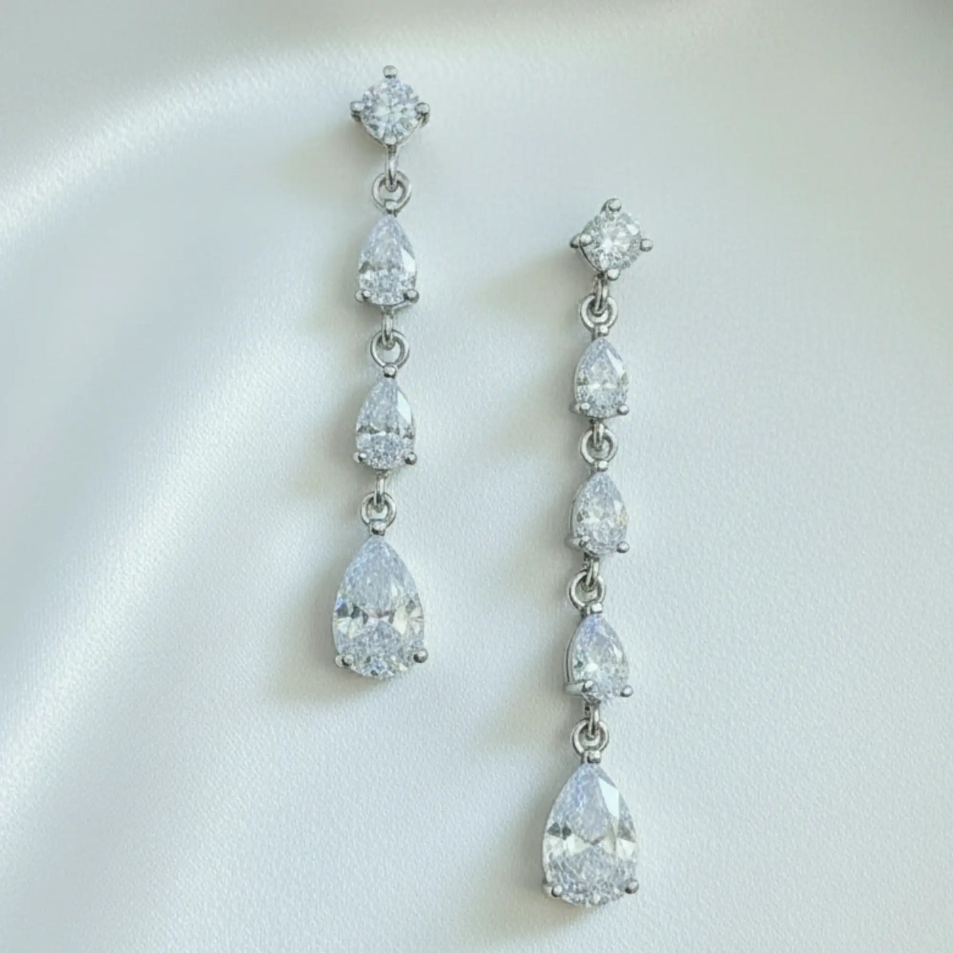 Bridal cascade drop earrings in gold plating photographed in a soft wedding jewellery 