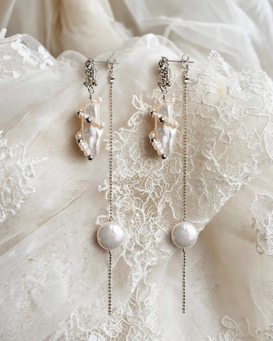 Freshwater pearl dangle earrings displayed as a jewelry product