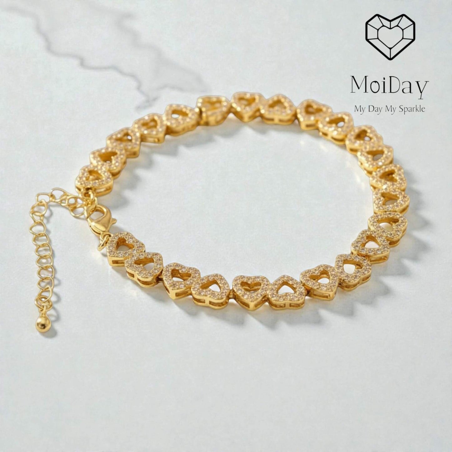 Delicate heart‑link bracelet with sparkling stones, crafted in brass with real gold or platinum plating. Features adjustable 16 cm + 5 cm chain and available in gold, silver, or rose gold. Elegant lightweight design ideal for brides, bridesmaids, and everyday wear; a timeless symbol of love, connection, and gratitude.