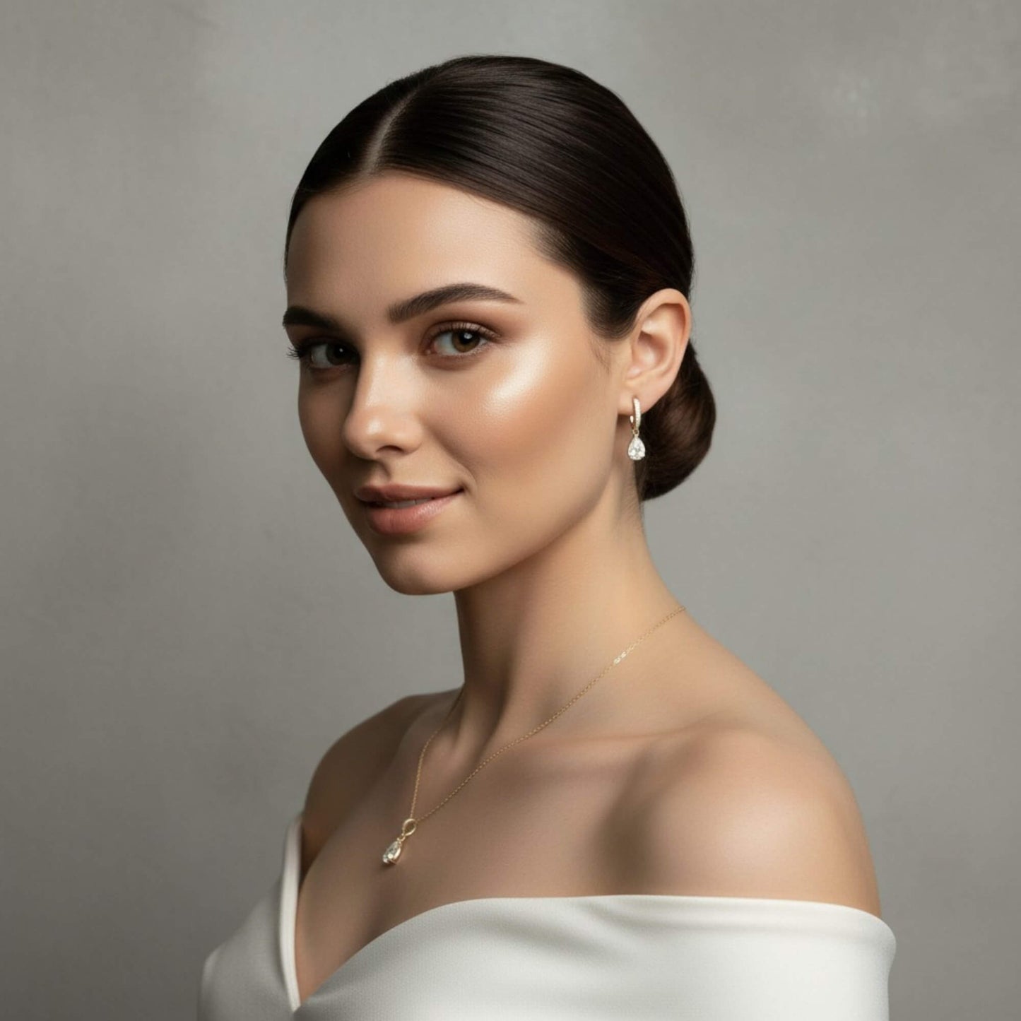 Silver earrings in a 'Moiday' jewelry box on a beige background