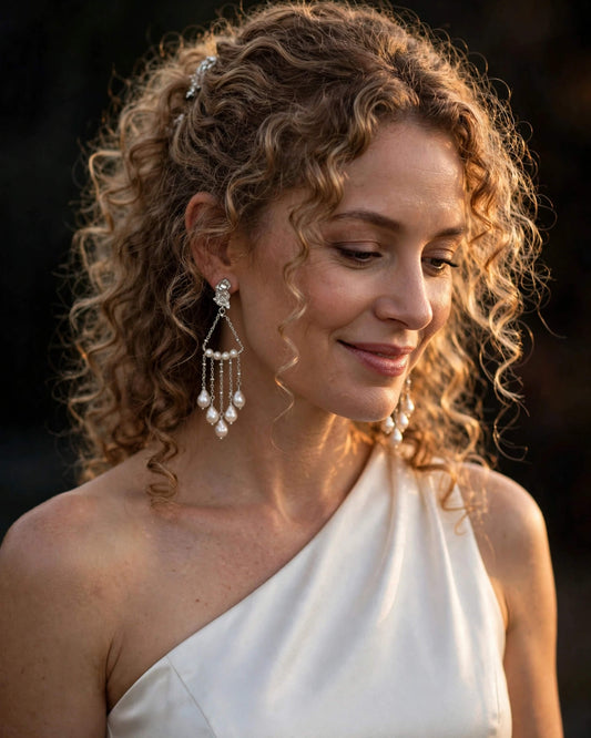 Wedding bride wearing elegant freshwater pearl dangle earrings