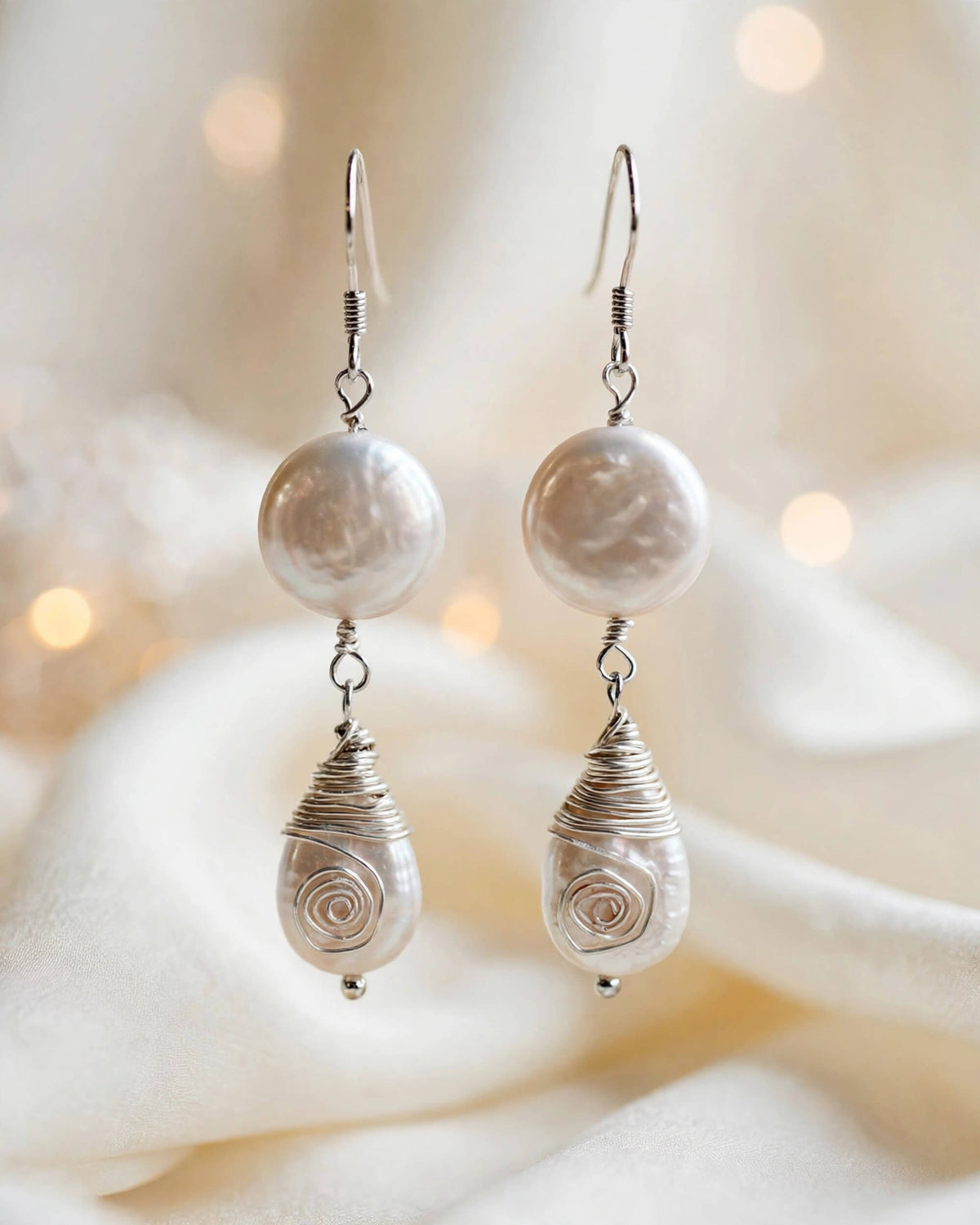 freshwater pearl drop earrings flatlay with sterling silver hook