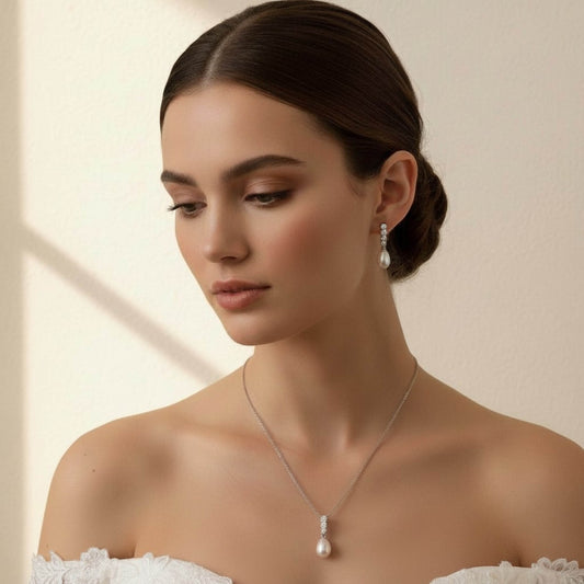 Australian bride wearing teardrop freshwater pearl necklace and earrings with soft bridal makeup.