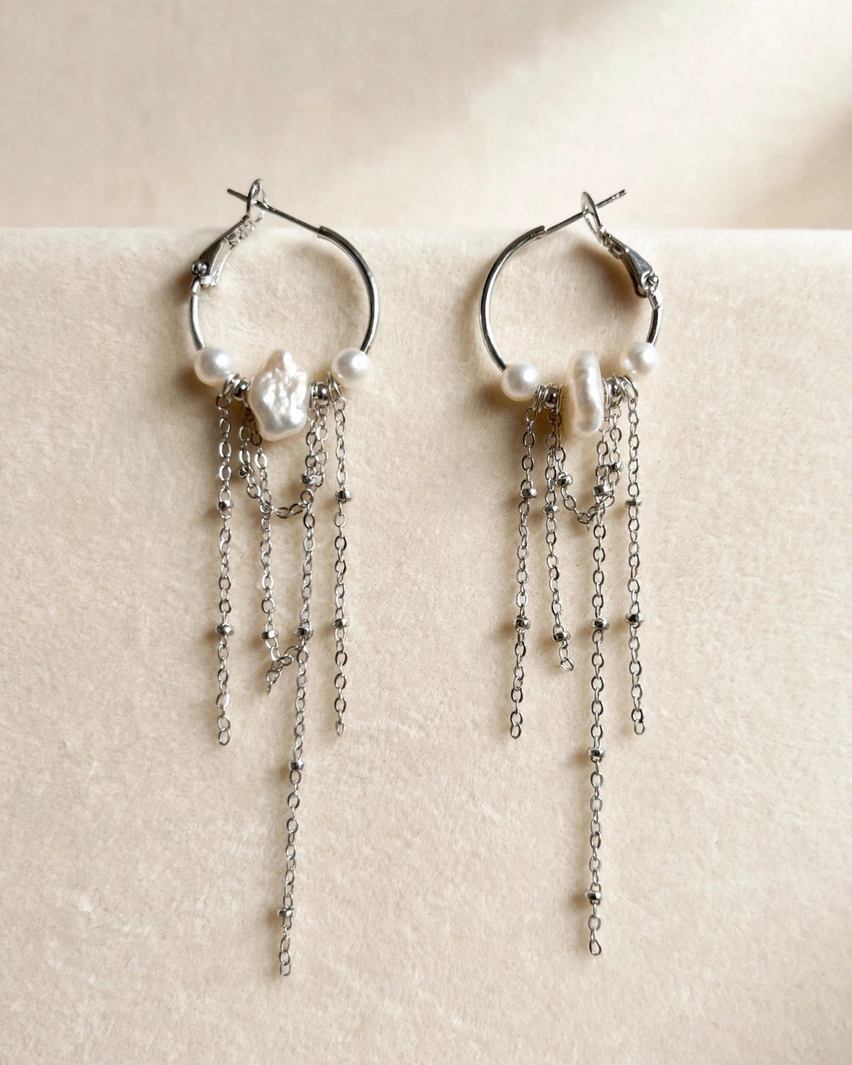  Close-up detail of freshwater pearl dangle earrings