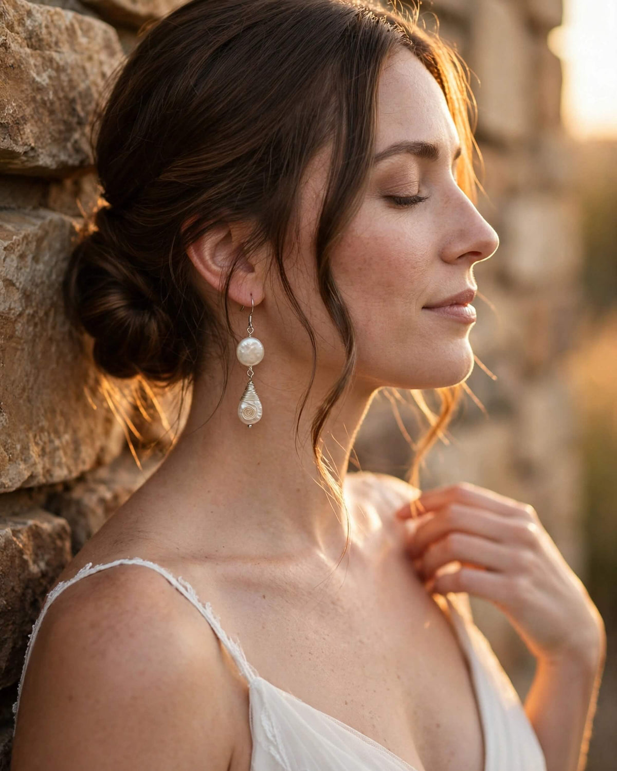 bride wearing pearl drop earrings with sterling silver hook in elegant bridal look