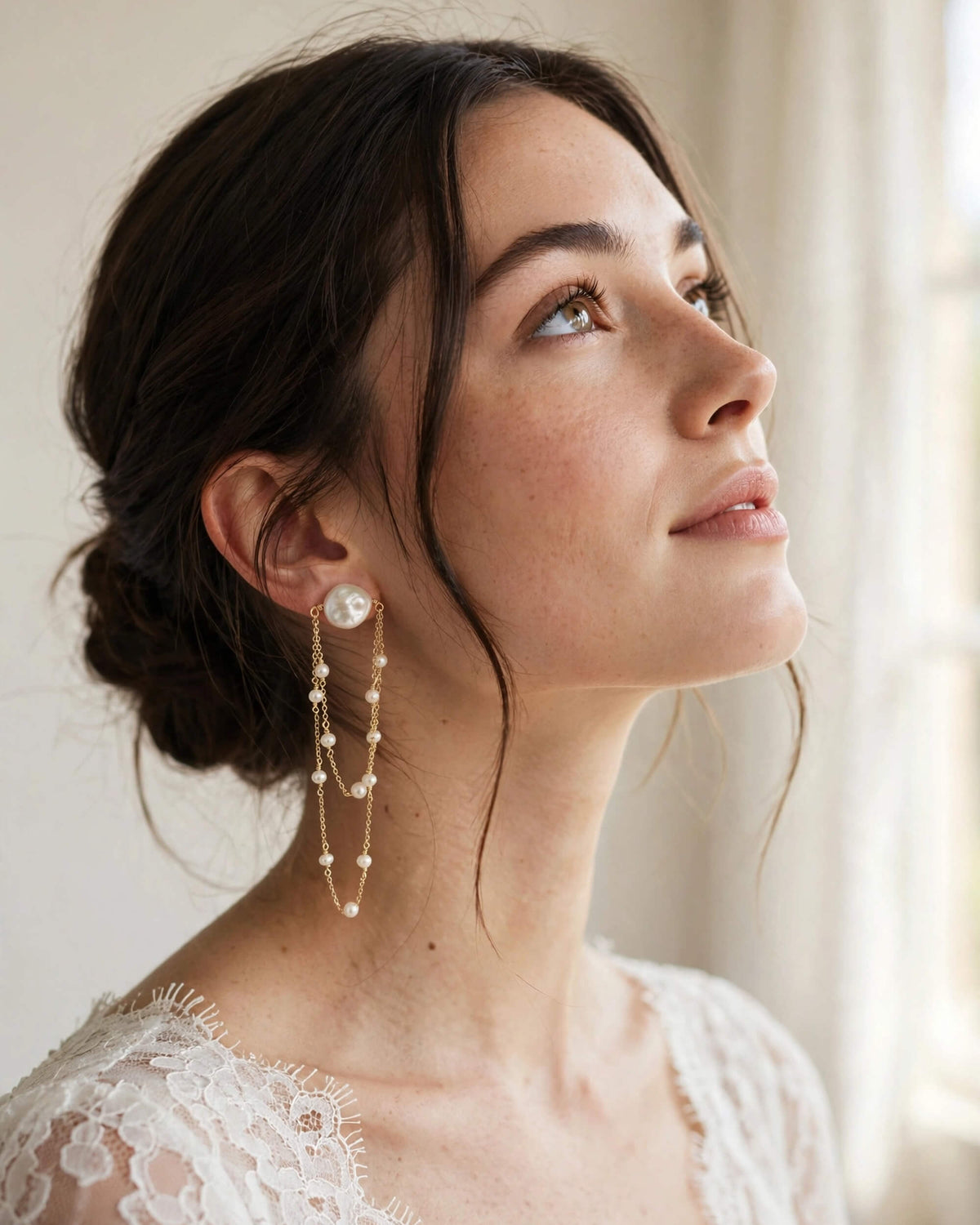 Bride wearing elegant freshwater pearl dangle earrings for her wedding
