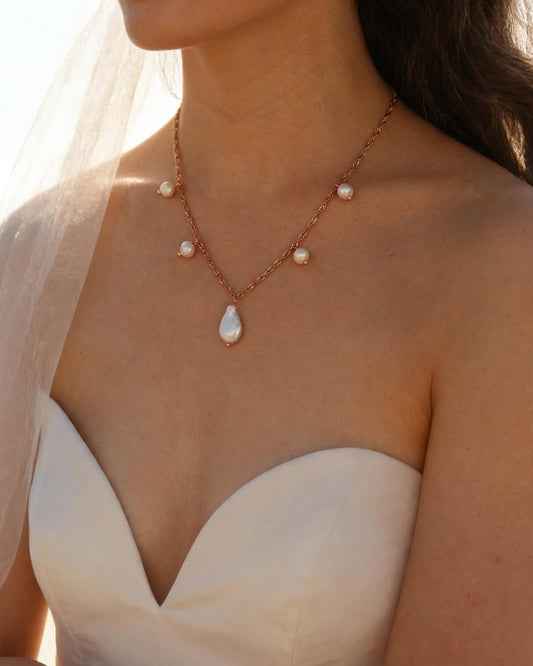 Freshwater pearl drop pendant necklace with gold chain and pearl accents