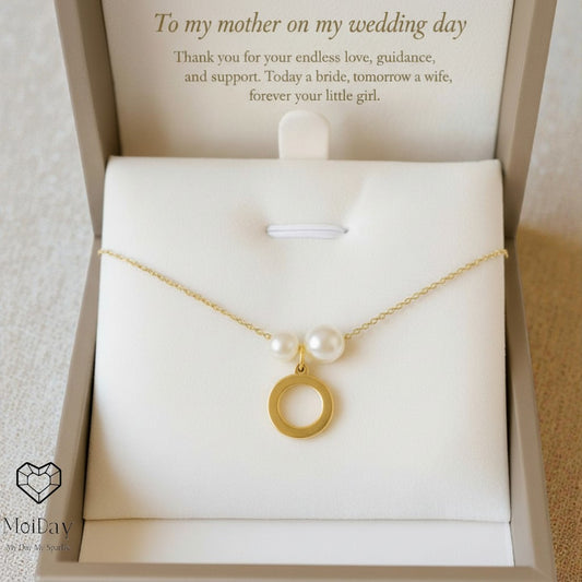Gold necklace with pearls in a jewelry box with a sentimental message