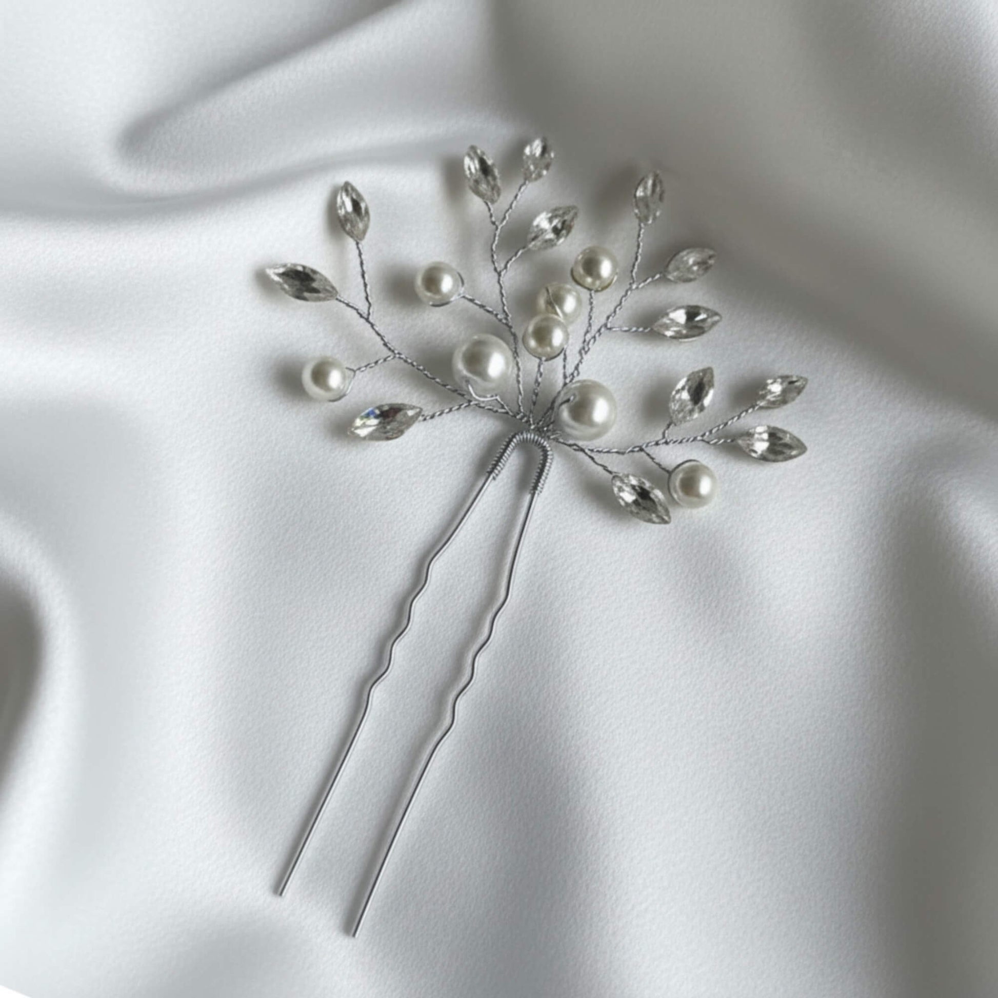 Elegant pearl and crystal wedding hairpiece with gold branch design for bridal updos.