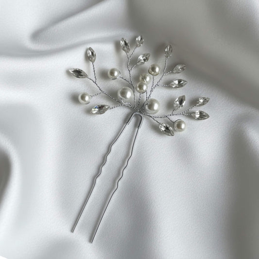 Elegant pearl and crystal wedding hairpiece with gold branch design for bridal updos.