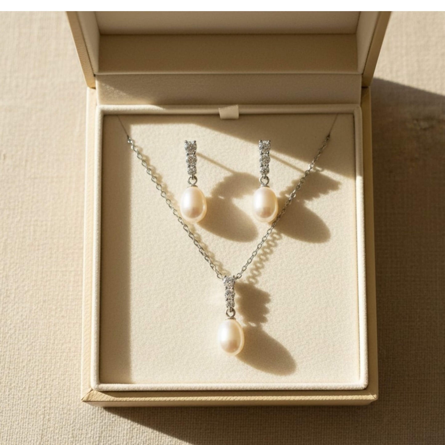 Bride on wedding morning wearing a delicate freshwater pearl bridal jewellery set.