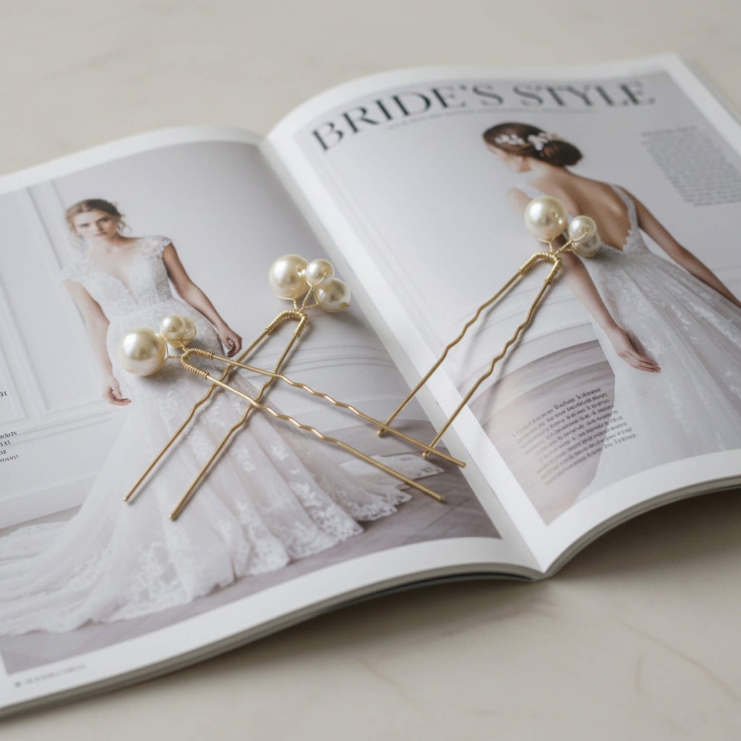 Modern bridal hair pins with luminous pearls and gold metal, photographed on magazine

