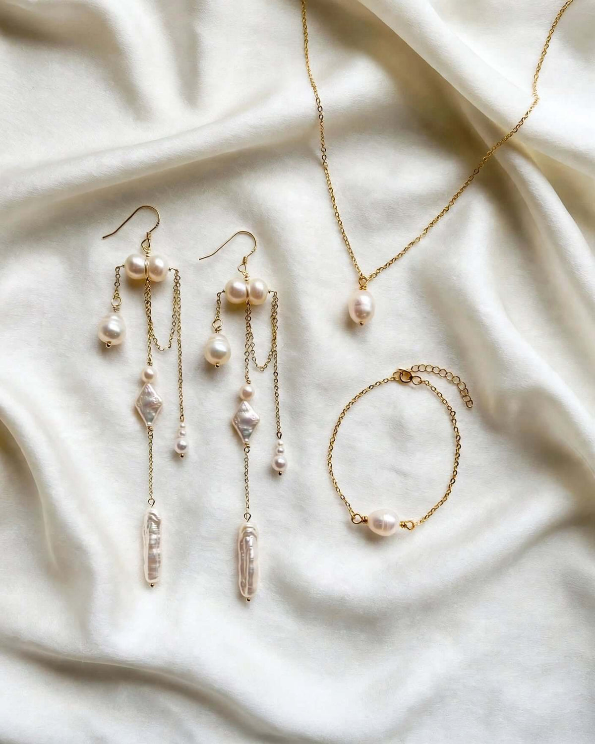 Gold boho pearl wedding earrings with iridescent shell charm and small seed pearls