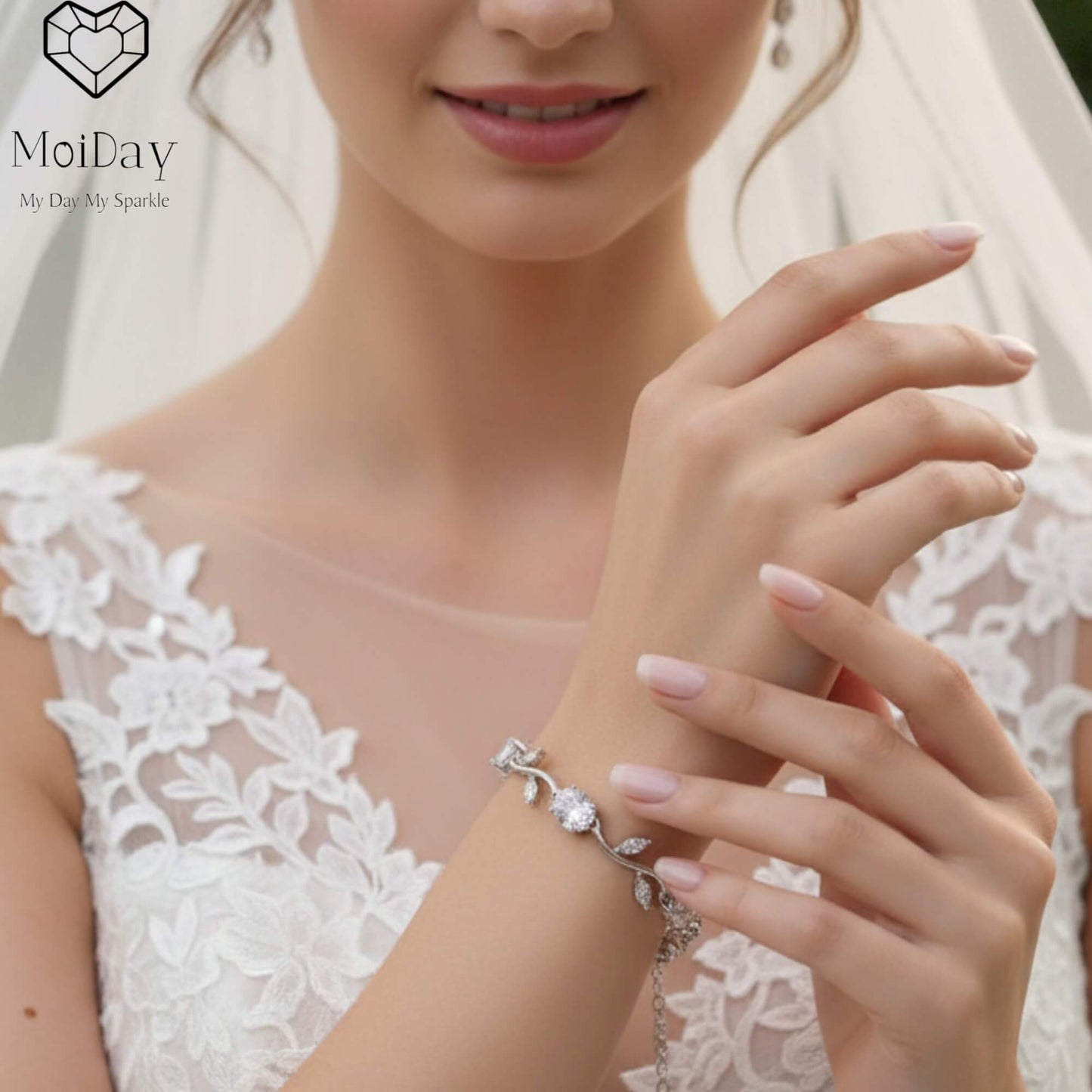 Moiday Celeste Vine Bridal Bracelet in silver with leaf motifs and sparkling stones on marble background.