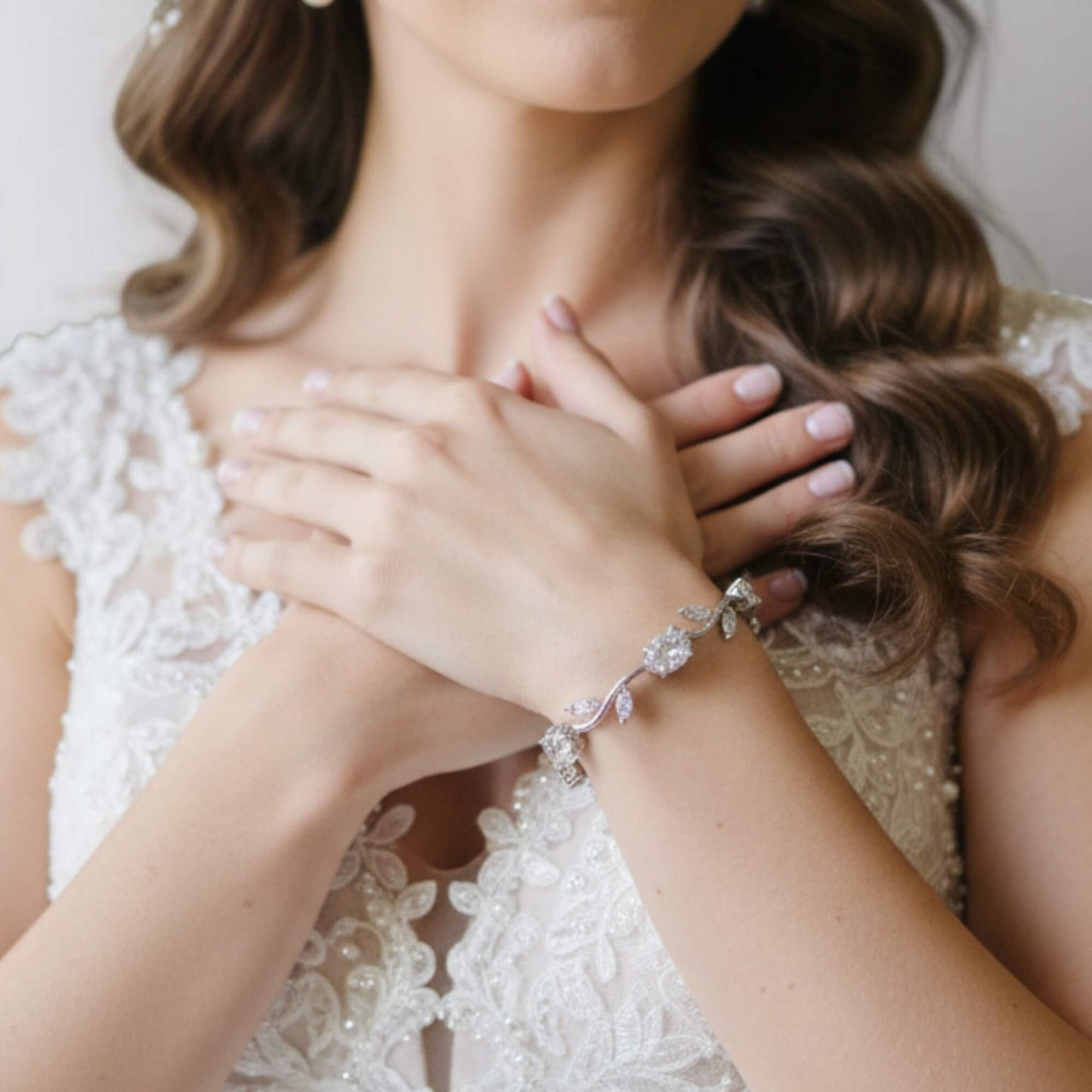Moiday Celeste Vine Bridal Bracelet in silver with leaf motifs and sparkling stones on marble background.