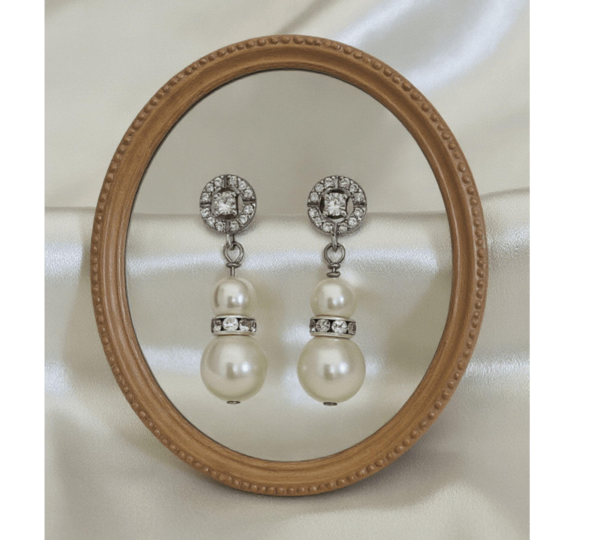 Gold and pearl drop earrings photographed worn on model with bridal styling