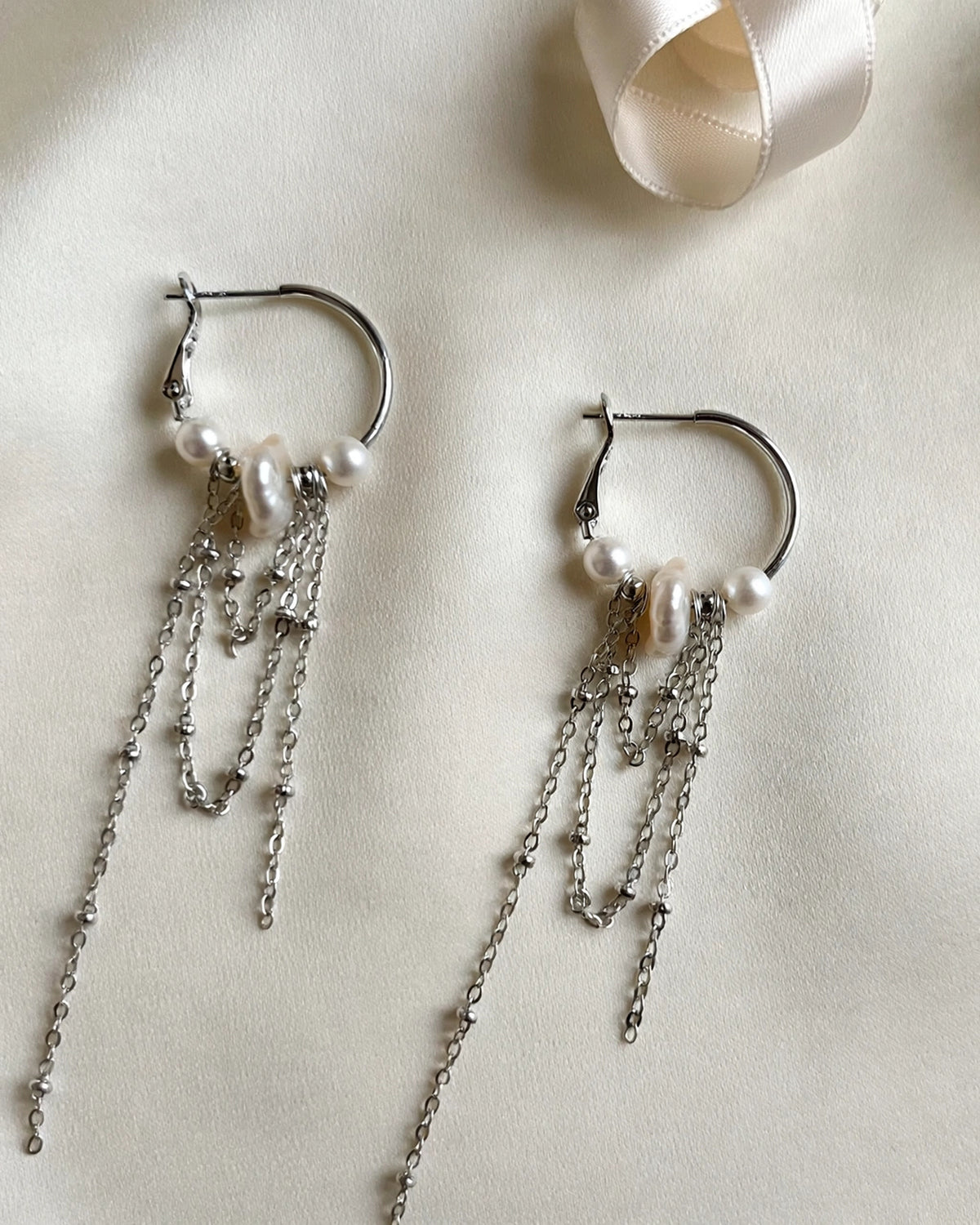 Pearl drop earrings featuring a delicate cascading design