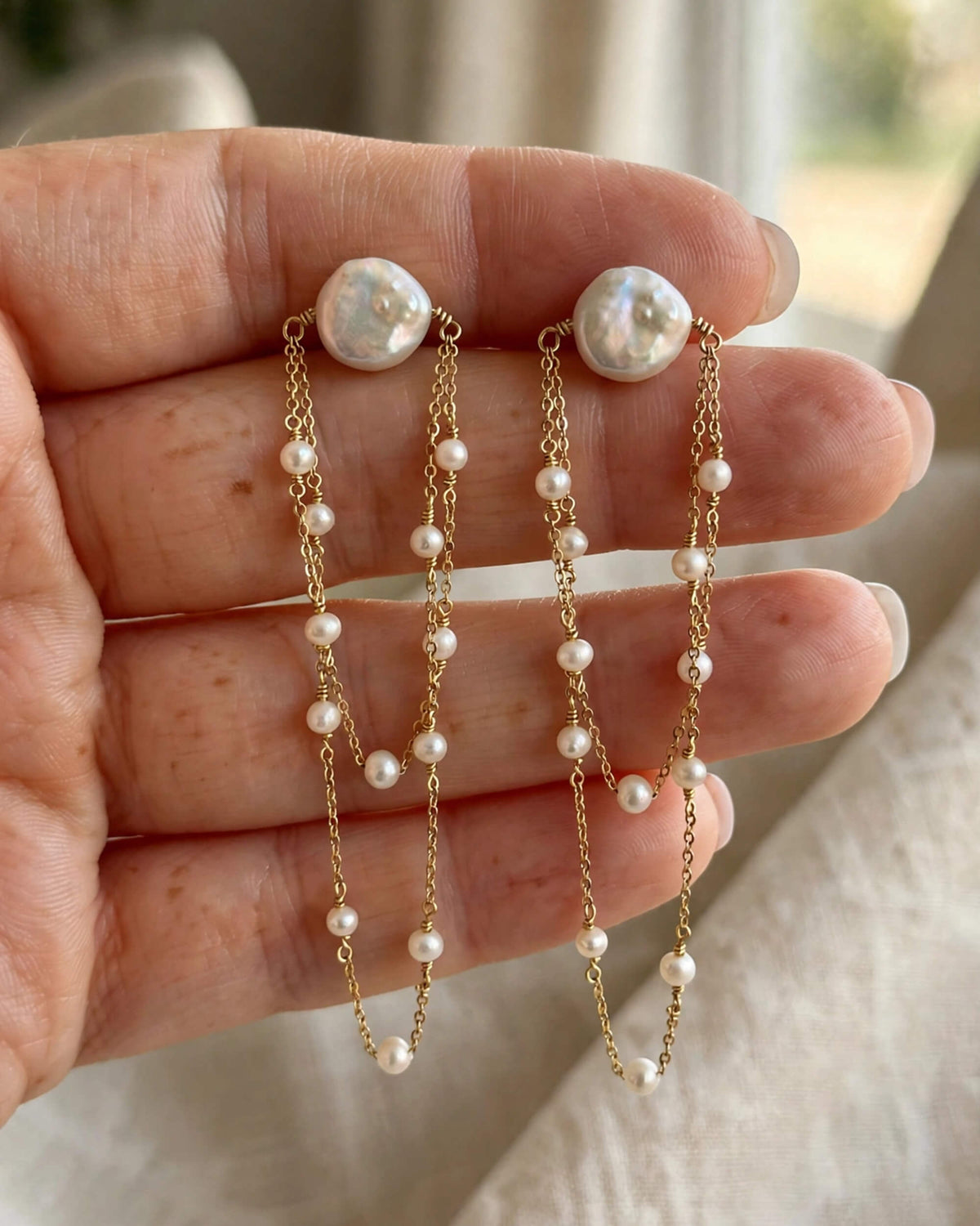 Close-up of the cascading detail on freshwater pearl earrings