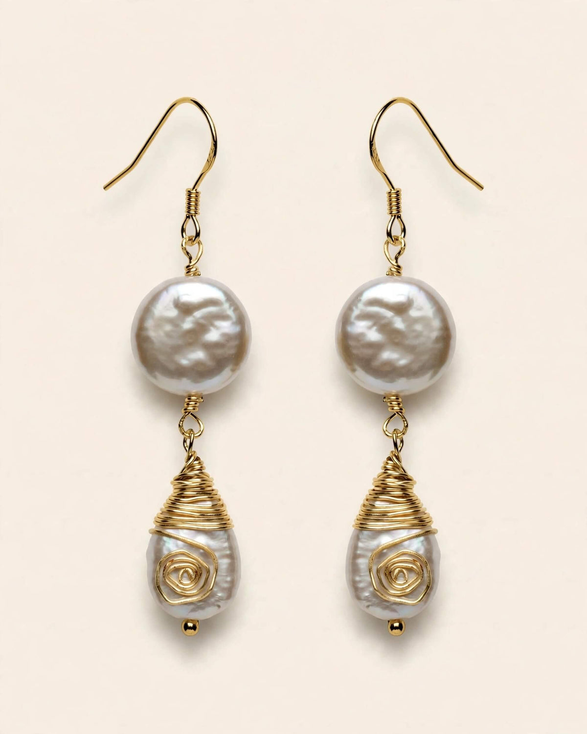 front display of pearl drop earrings showing dual-pearl design