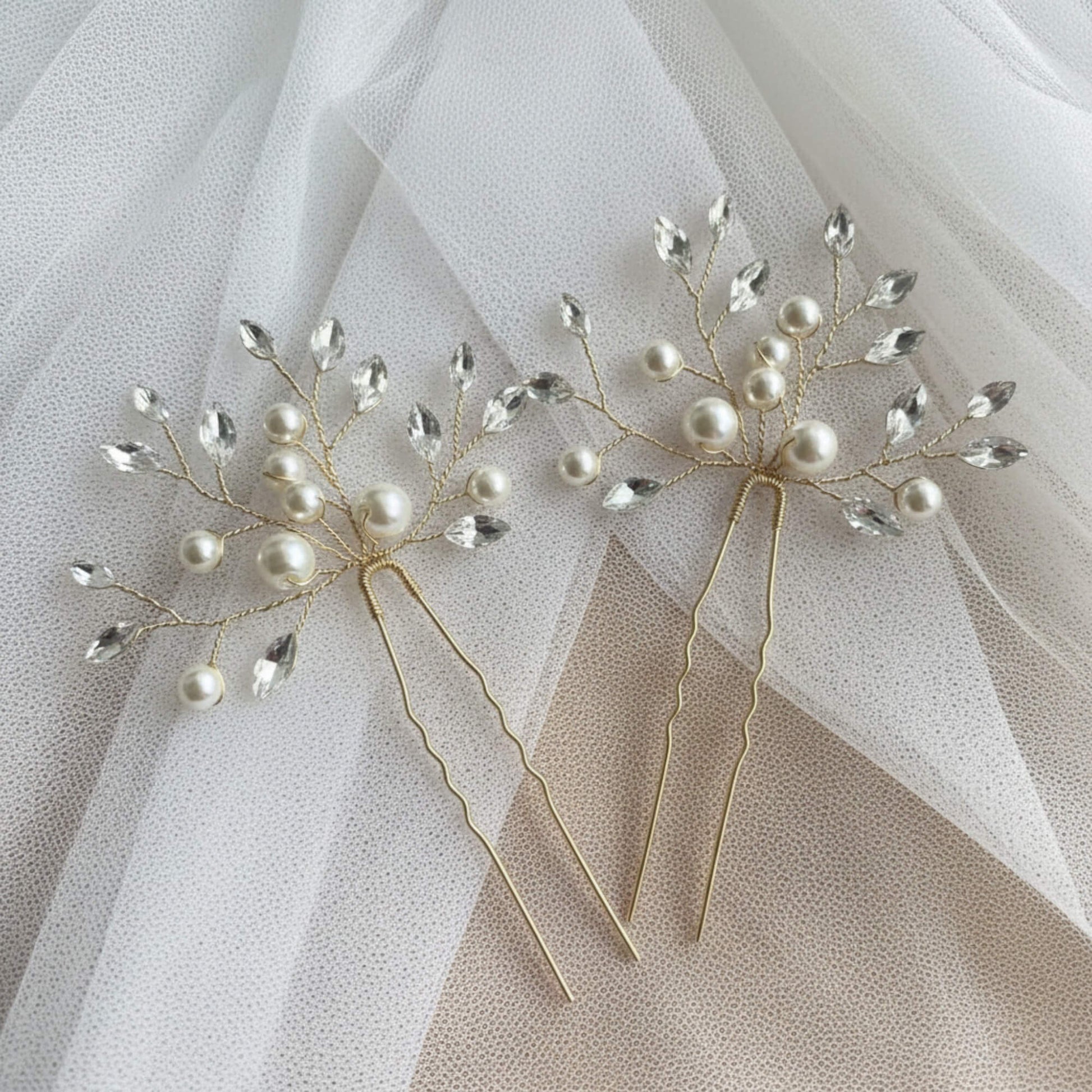 Gold wedding hair pin designed for low buns and soft romantic bridal hairstyles.