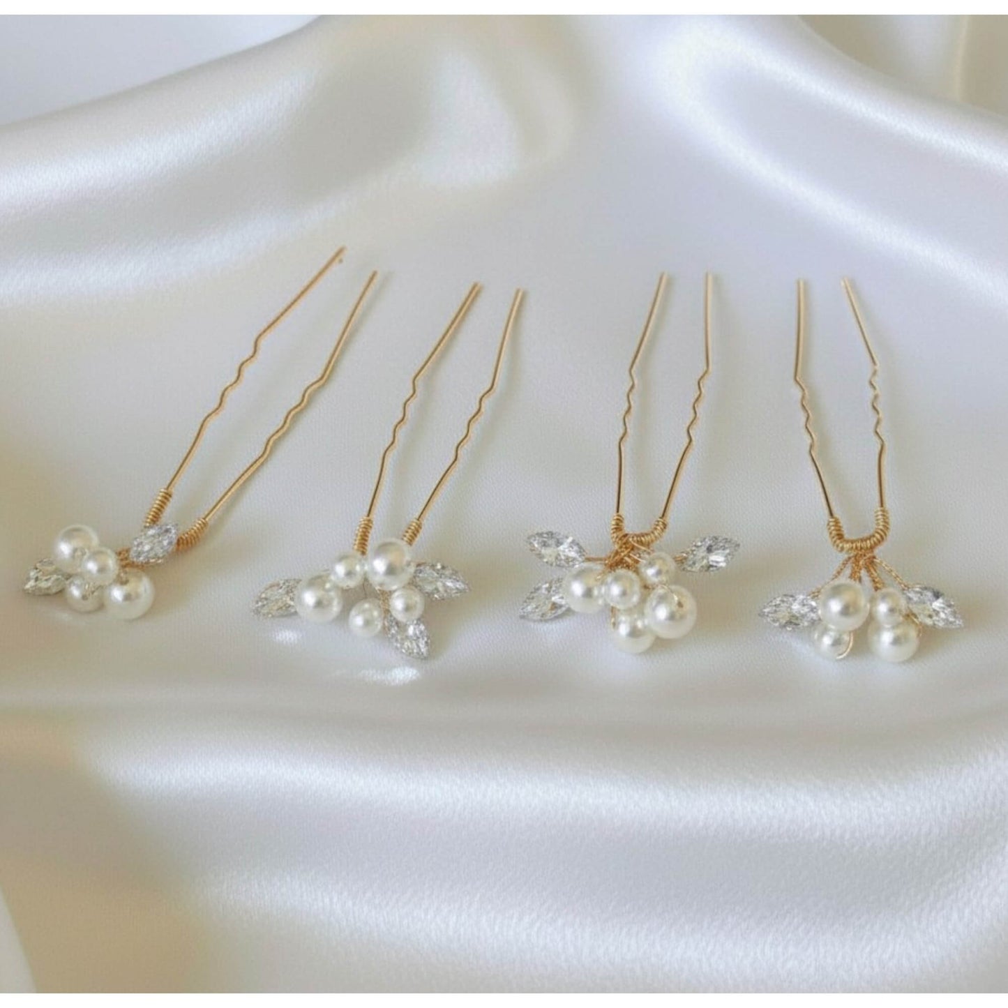 Bridal pearl hair pin set of four photographed on smooth satin background, premium minimal aesthetic for Australian brides.